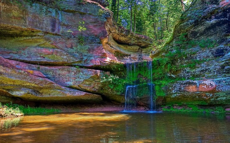 waterfall_between_rocks_with_fantastic_colors.jpg