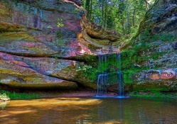 Waterfall between rocks with fantastic colors