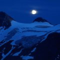 Moon over Snow_covered Mountains