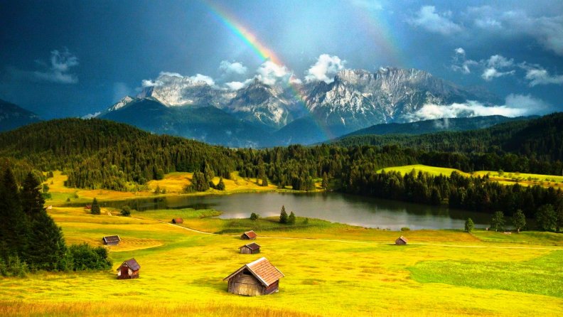 Rainbow At The Alps
