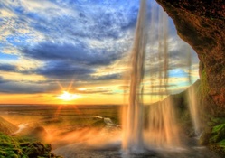 exceptional cave waterfall at sunset hdr