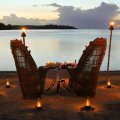 candlelight table for two at sunset in bora bora