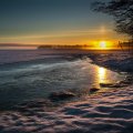 sunset on a frozen lake