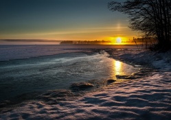 sunset on a frozen lake