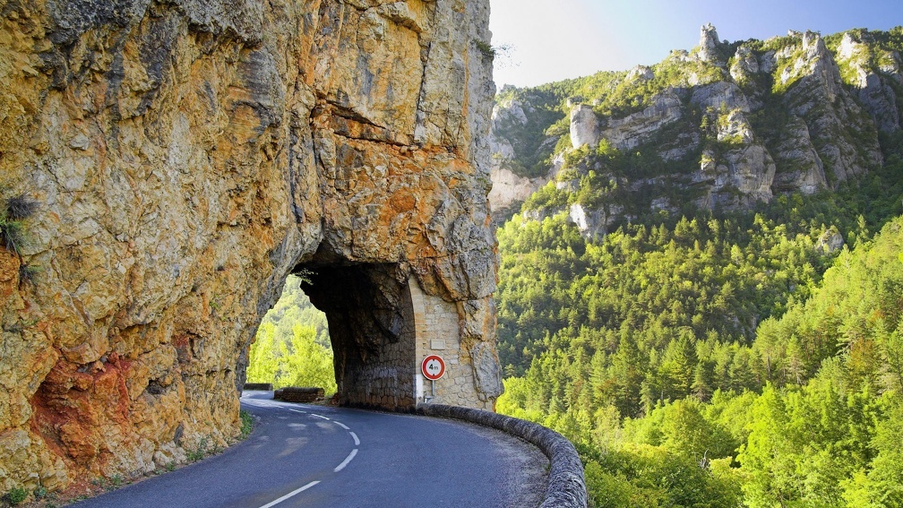 winding road through a rock portal in france