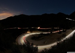 car lights on a mountain road