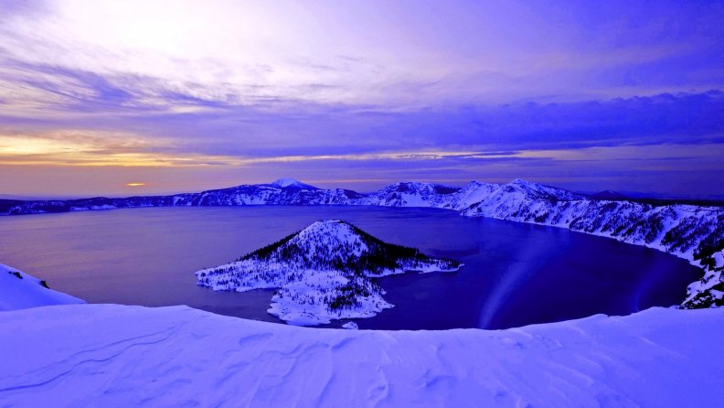 blue dawn on crater lake in winter