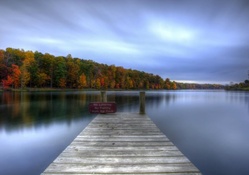 wooden dock on a calm lake hdr