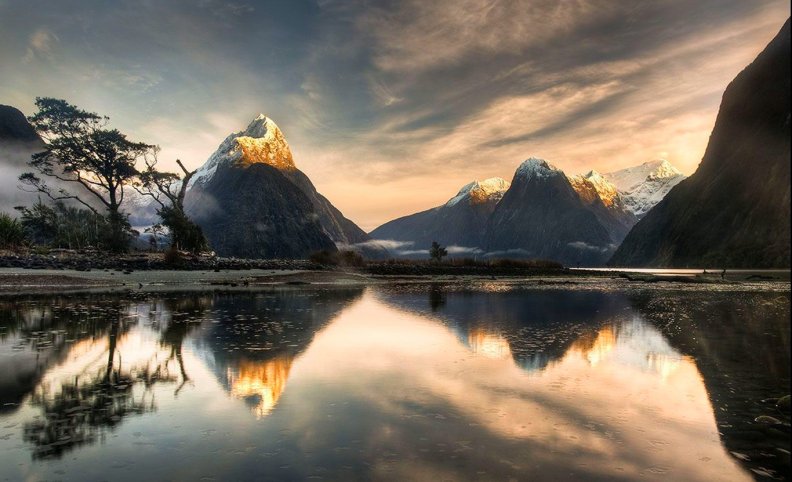 Snowy Peaks Reflections At Sunrise
