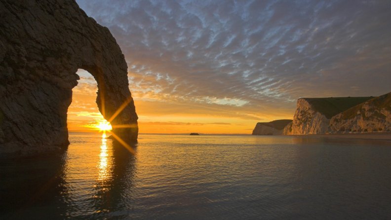 durdle_door_rock_formation_in_england_at_sunset.jpg
