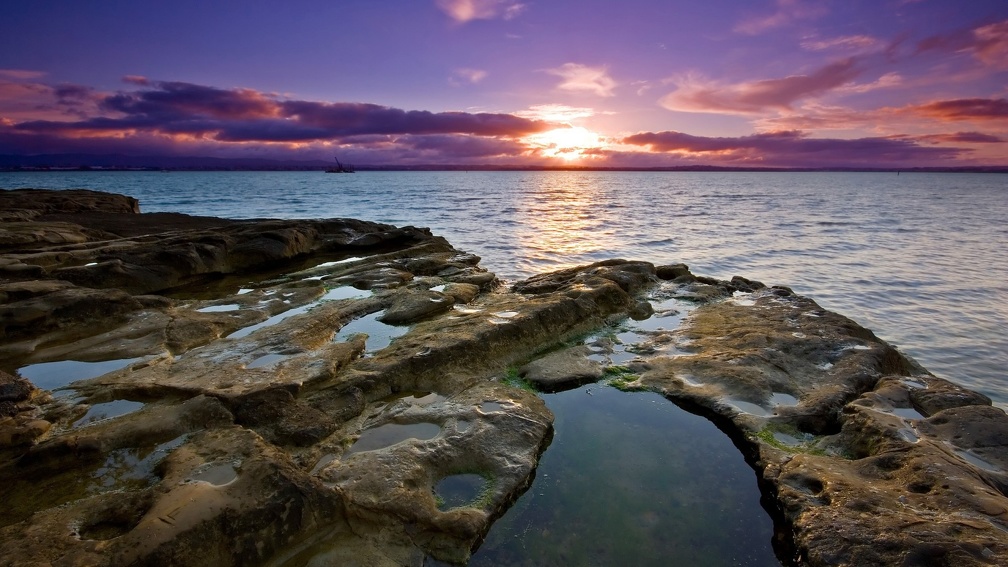lovely peaceful sunset over rocky seashore