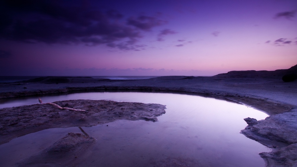 tidal pool in purple dusk