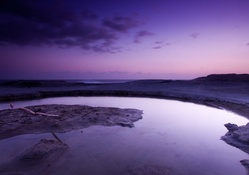 tidal pool in purple dusk