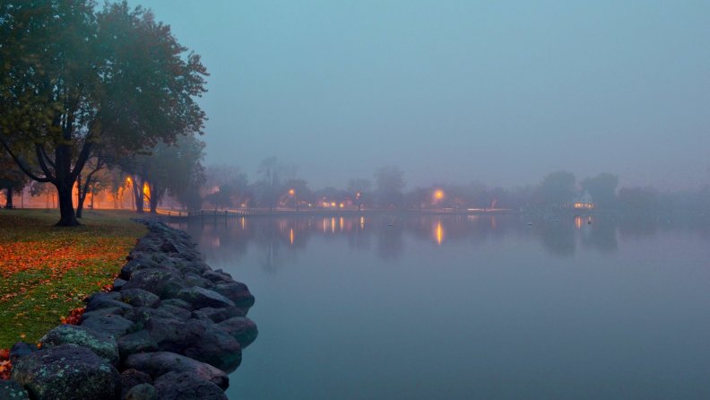 autumn evening on a foggy lake