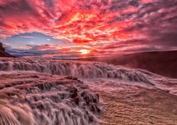 red sunset over river rapids hdr
