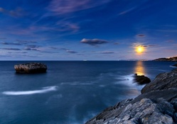 wonderful rocky seacoast under moonlight