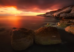 magical rocky seashore at sunset hdr