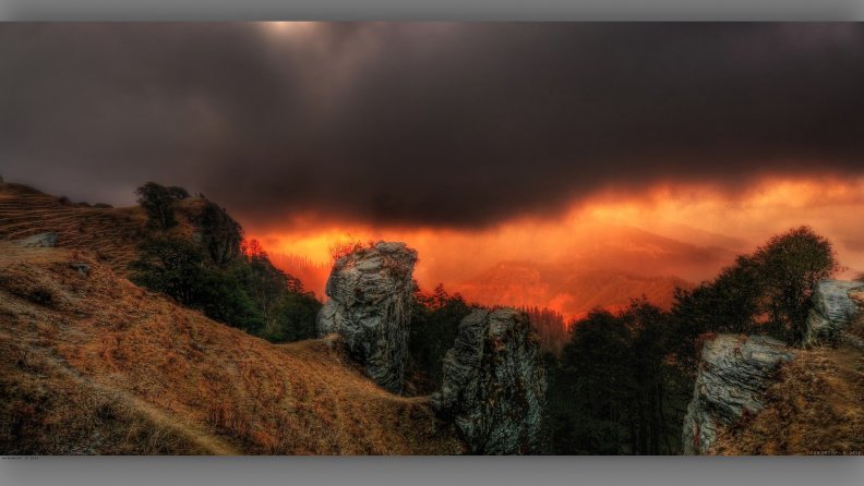 rain_clouds_over_mountains_at_sunset_hdr.jpg