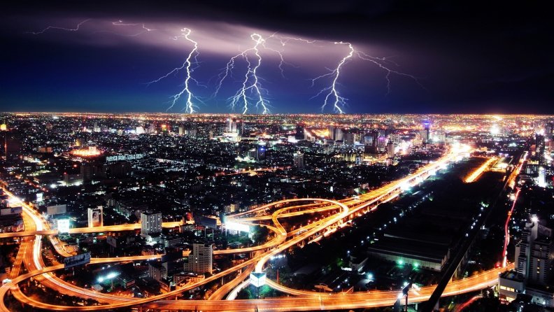 lightning storm over a city at night
