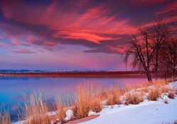 spectacular red sunrise over a lake