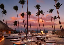 sunset over a beautiful beach resort