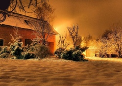 barn house on a snowy winter night