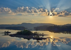 beautiful sunrays reflection on a lake