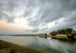 bamboo boats on a lake in bangladesh
