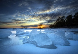 iced river landscape at sunset