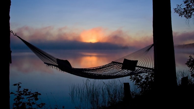 hammock overlooking lake at morning fog