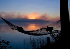 hammock overlooking lake at morning fog