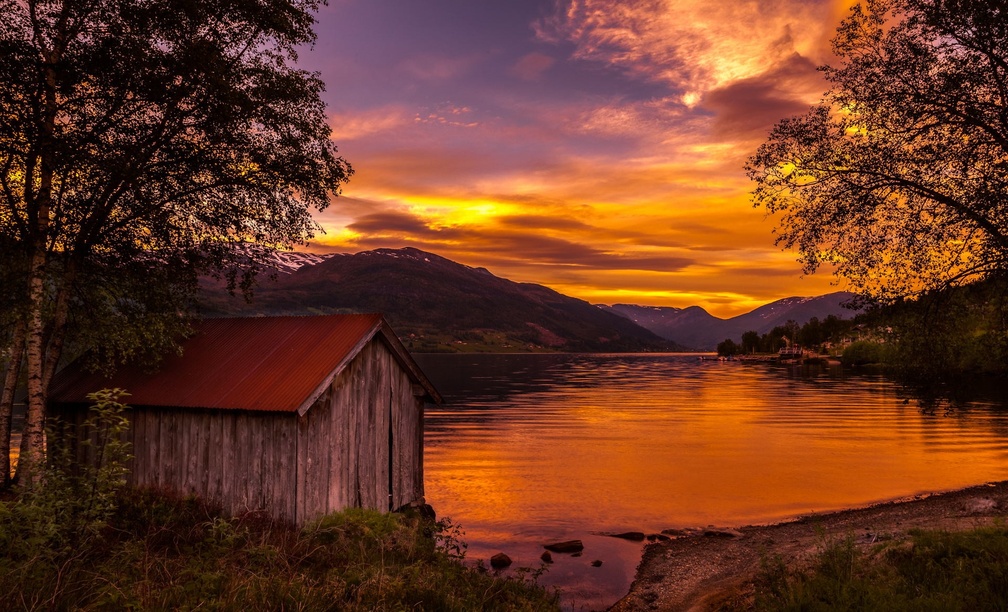 The Boathouse Of The Lake At Sunset