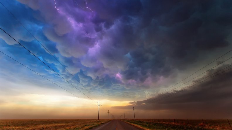 spectacular lightning storm over a texas road hdr