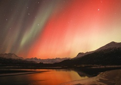 red aurora borealis over alaska