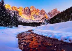 stream in the golden dolomite mountains