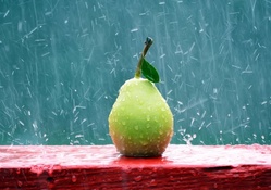 A Photo Of A Pear On A Red Window Sill