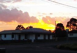 SUNSET OVER OLD HOUSE