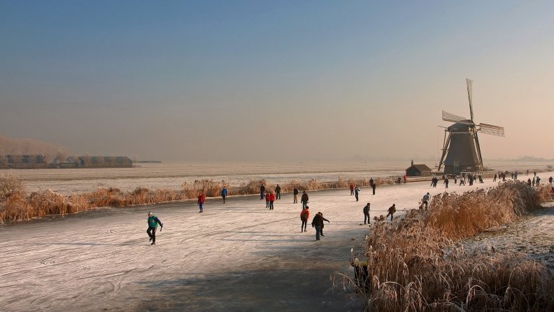 people_ice_skating_on_a_river_in_holland_hdr.jpg