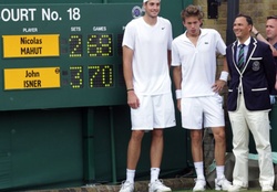 John Isner, Nicolas Mahut &amp; Umpire standing next to the historic scoreboard after the longest match in Open history.