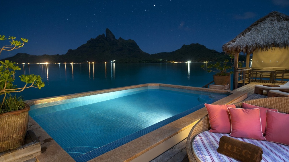 resort pool in bora bora at night