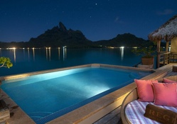 resort pool in bora bora at night