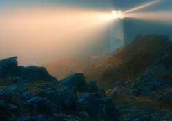 bright lighthouse on a foggy night