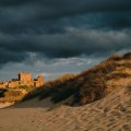 old castle on a sea coast under stormy sky
