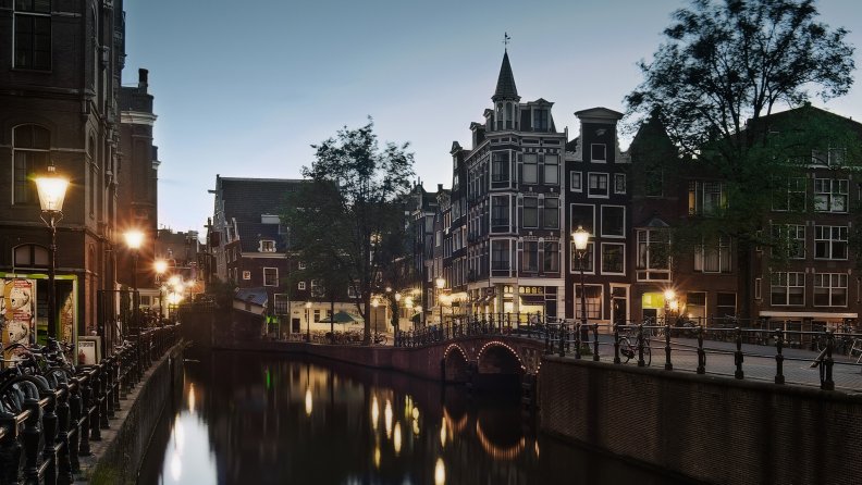 evening on an amsterdam street canal