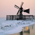 windmill by the river at winter