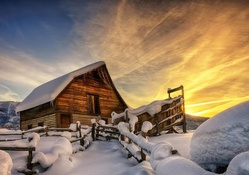 wooden mountain cabin in winter