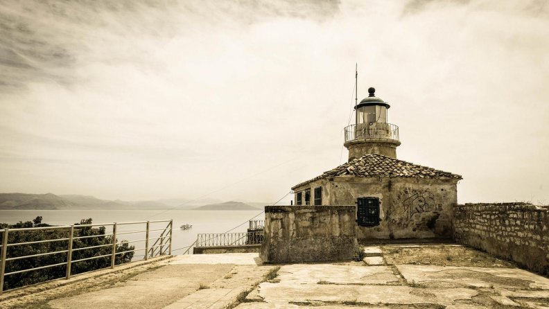 old lighthouse above a bay