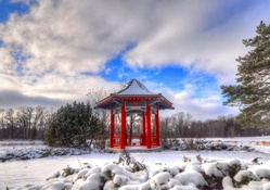 beautiful red oriental arbor in a winterscape