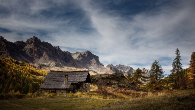 mountains_above_a_cabin_in_a_meadow.jpg
