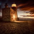 beautiful stone lighthouse at twilight hdr
